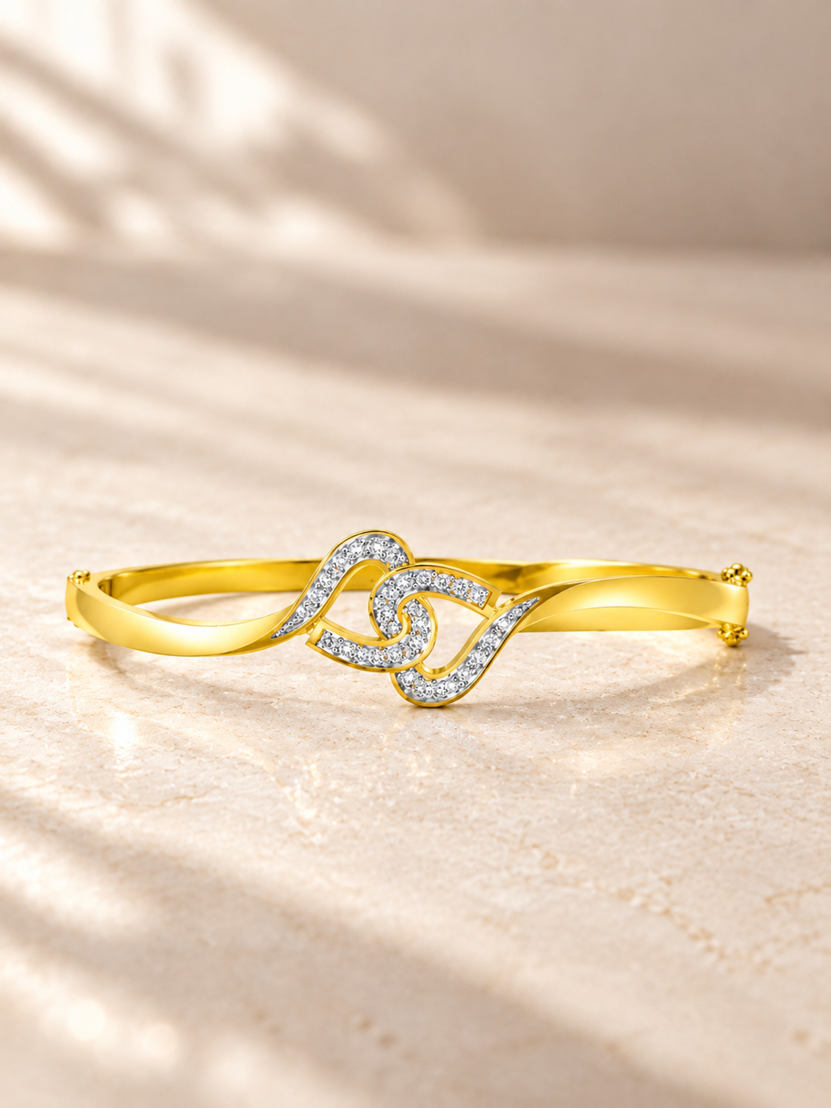 INTERLOCKING SWIRL/14k YELLOWGOLD/OPENWORK BANGLE, lifestyle view